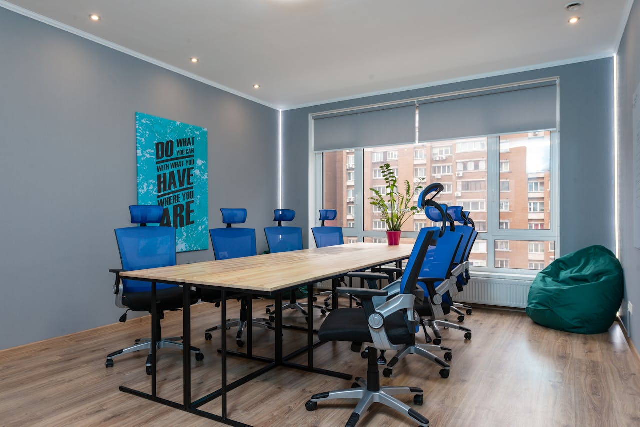 Table with armchairs in conference room